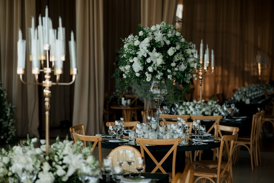 Elegant wedding reception table setting with floral centerpieces